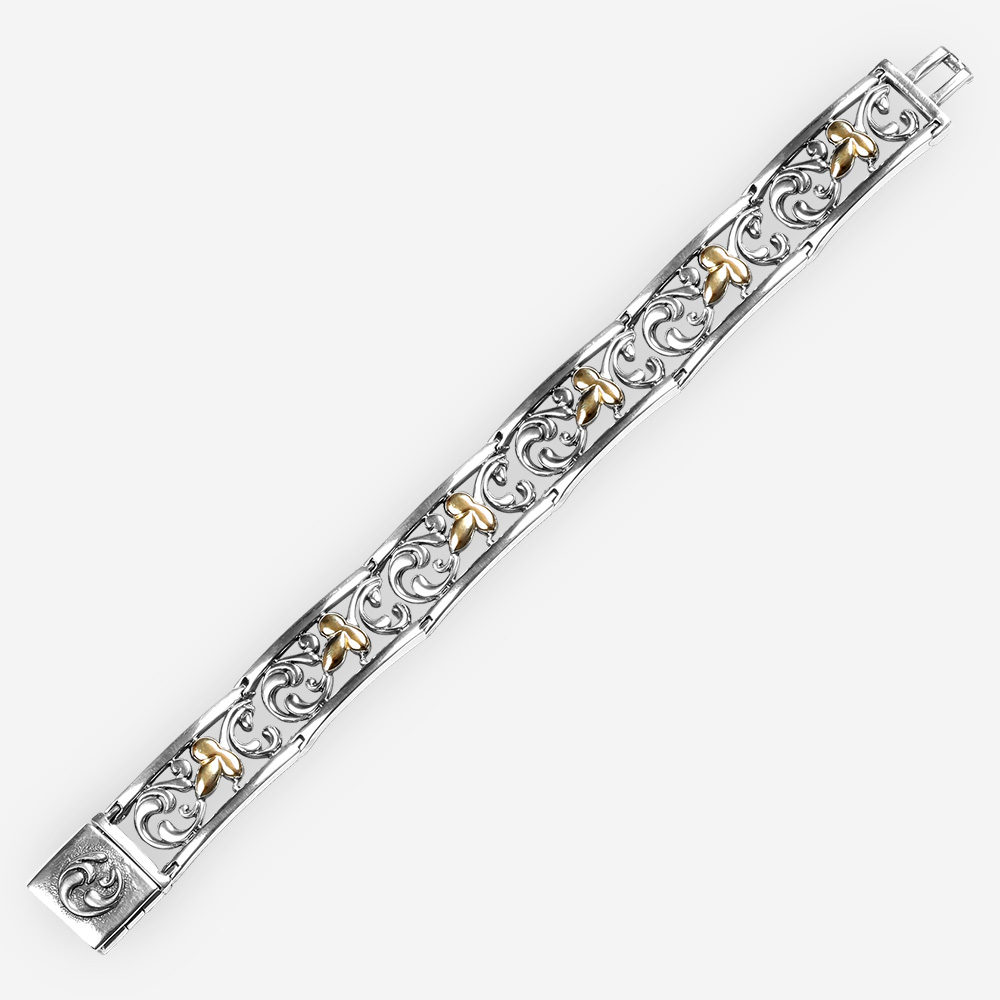 Pulsera de dos tonos de plata fina con figuras de hojas de oro de 14k y filigranas de fondo.