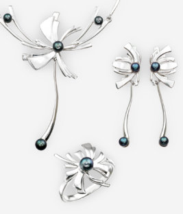 The Origami jewellery collection is crafted in 925 sterling silver with an oriental flower detail and black freshwater pearls