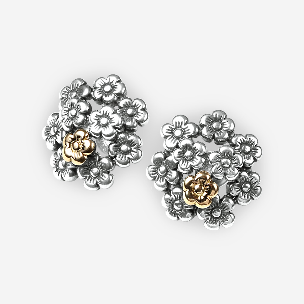 Aretes de tendencia floral de plata fina con una pequeña flor de oro de 14k y cierre con paloma y poste.