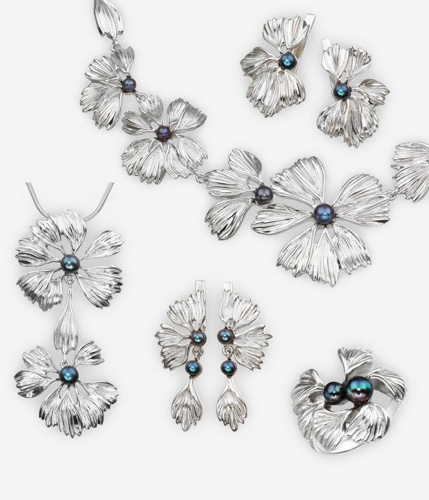 The Stone Flower jewelry collection is crafted in 925 sterling silver with a floral design and black freshwater pearls